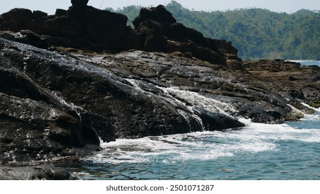 Ocean Waves Crashing Against Rocky Shoreline Creating Foamy Splashes - Powered by Shutterstock