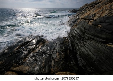 Ocean waves crashing on rocky coastline in Maine