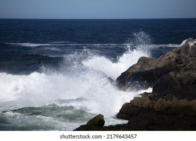 Ocean Waves Crashing Onto A Rocky Shore