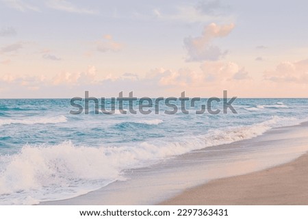 Ocean waves with foam at sunset. Airy light tranquil water landscape.
