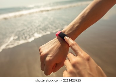 Ocean Waves On Beach With Wearable Technology On Wrist Monitoring Sports And Exercise Activity For Health And Fitness