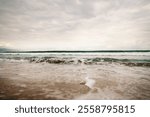 ocean waves on Santa Monica beach in cloudy november day