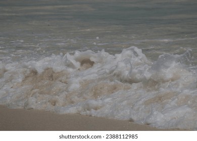 Ocean waves rolling on the Sandy beach