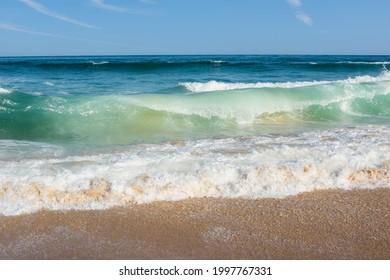 Ocean Waves Washing Up On The Sunny Beach