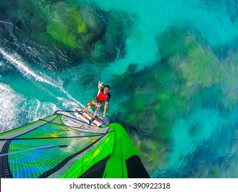 Ocean world of windsurfing over coral reef