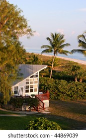 oceanfront beach home at sunset Sanibel Florida