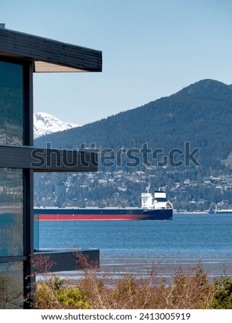 Ocean-going cargo vessel in Coal harbor bay in Vancouver