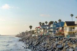 Oceanside Beach Houses In California With Stairs On The Natural Rock Seawall