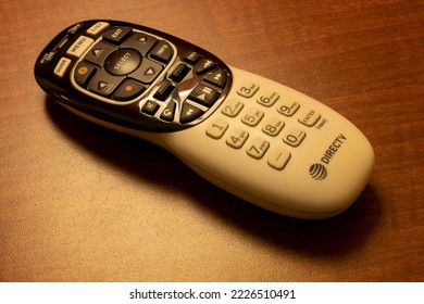 Oceanside, CA, USA - May 15, 2022: A DIRECTV Remote Control On A Wooden Table In A Hotel Room. DirecTV Is An American Multichannel Video Programming Distributor.