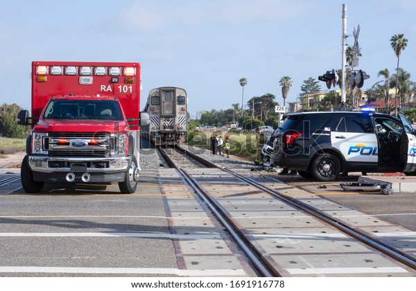 Oceanside, California / USA - April 02,\
2020: A malfunctioning level crossing barrier led to an vehicle\
being struck by a train at Cassidy Street in\
Oceanside