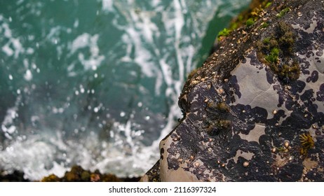 Oceanside Cliffs and Waves Overview - Shutterstock ID 2116397324