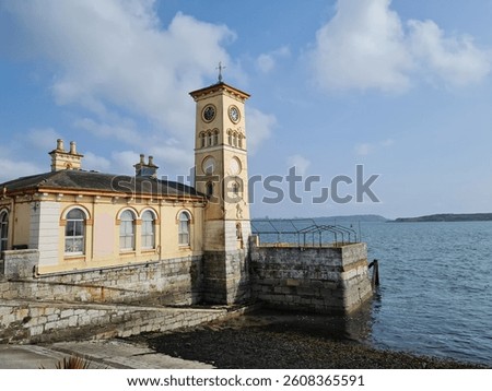oceanview in cobh ireland with a small clocktower on a beautiful springday