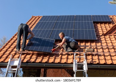 Ochojno, Poland - April 8, 2020: Workers installing solar electric panels on a house roof in  Ochojno. Poland - Shutterstock ID 1803691789