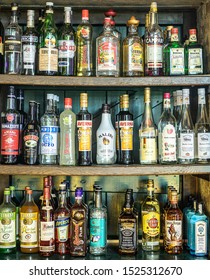 Ochtendung Germany 25.05.2019 - Bitters And Liquor Bar Counter With Different Bottles Vintage Style Ambient Light