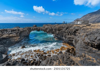 ocky beach with a natural arch in Las Puntas. El Hierro island. Canary Islands	 - Powered by Shutterstock