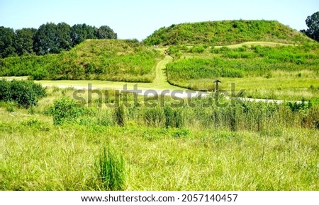 Ocmulgee Mounds National Historical Park in Macon, Georgia, preserves  earthworks built before 1000 CE by the South Appalachian Mississippian culture. Great Temple Mound, Lesser Temple Mound and trail