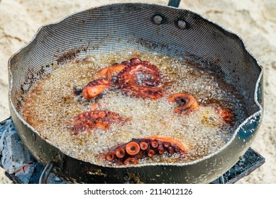 Ocotopus Boil In Oil On A Sandy Beach. Picnic On A Beach In Zanzibar, Tanzania