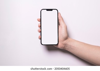 Oct 1, 2021 Bangkok, Thailand : Hand Holding Blank Screen Of Black IPhone 13 Pro Max Isolated On White Background.