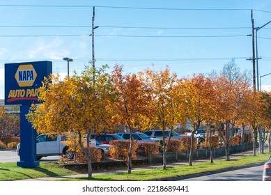 OCT 10, 2022-ANCHORAGE, AK, US: Row Of Parked Cars Near Store Logo Of NAPA Auto Parts In Midtown Anchorage, Alaska. American Retailers Distributing Automotive Replacement Parts, Accessories, Service