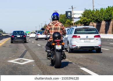 Oct 12, 2019 Redwood City / CA / USA - Motorcyclist Riding On The Freeway On The Carpool Lane