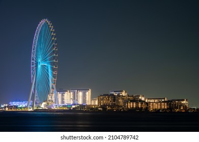 Oct 15th,2021,Dubai ,UAE.  Colorful view of the dubai eye ferris wheel captured from the palm jumeirah west at Dubai,UAE.