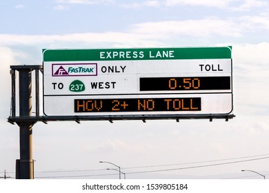 Oct 18, 2019 Milpitas / CA / USA - Freeway Express Lane Sign, Indicating Applicable Tariff And HOV 2+ No Toll Exception; San Francisco Bay Area