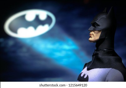 OCT 27 2018:  Portrait of Batman with the Bat Signal, Gotham City - DC Comics - Mego action figure