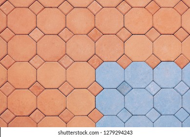 Octagon pattern of orange and blue brick stone pavement floor background in exterior decorations design concept, top view with copy space 