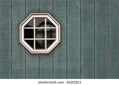 Octagon Shed Window On Green Wood