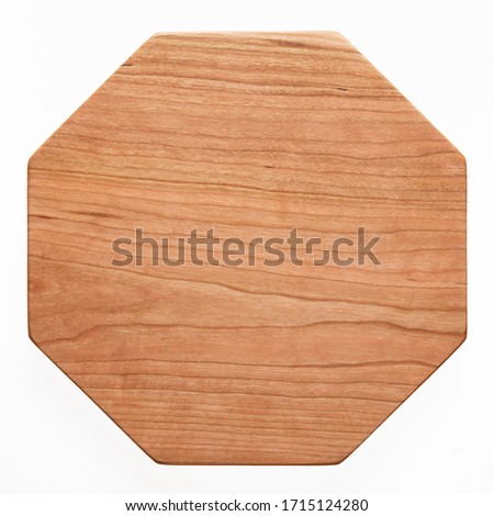 Octagonal handmade cherry wood wooden chopping board. Handmade cherry wood pallet. Cherry wood texture.