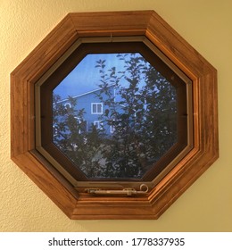 Octagonal Window Looking Into Neighbors Yard