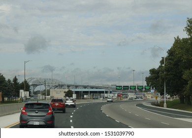 October 06 2019: Sarnia Canada/Port Huron US Border: Editorial Photo Of Cars Line Up At The Border Crossing Between Canada And The USA