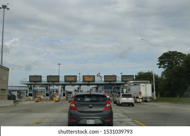 October 06 2019: Sarnia Canada/Port Huron US Border: Editorial Photo Of Cars Line Up At The Border Crossing Between Canada And The USA