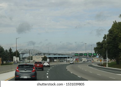 October 06 2019: Sarnia Canada/Port Huron US Border: Editorial Photo Of Cars Line Up At The Border Crossing Between Canada And The USA