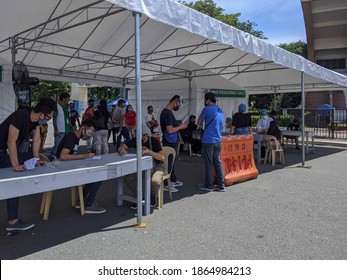 OCTOBER 1, 2020-MANILA PHILIPPINES : Tents At The Manila Grandstand For Covid 19 Rapid Testing.  People Lined Up For The Covid 19 Rapid Test