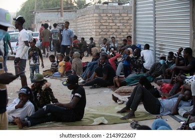 October 10, 2021: Migrant Women And Men Wait By The United Nations High Commissioner For Refugees (UNHCR) Headquarters On  In Tripoli, Libya. 