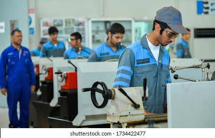 OCTOBER 15,2014-DOHA,QATAR:Qatar Technical School Students Training Mechanical Engineering Service Industrial Oil And Gas Equipment As Part Of A Study