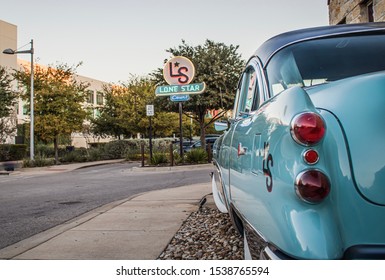 October 18, 2019 - Austin, Texas - Old classic car in the parking lot of the Lone Star Court at the Domain shopping area.