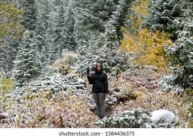 October 1st 2017 - Grand Teton National Park, Wyoming. Woman Stands On The Trail Holding Bear Mace. 