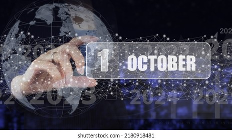 October 1st . Day 1 Of Month, Calendar Date. Hand Hold Virtual Screen Card With Calendar Date.  Autumn Month, Day Of The Year Concept