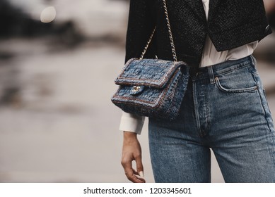 October 2, 2018: Paris, France - Fashionable girl wearing a Chanel bag outside a fashion show during Paris Fashion Week  - PFWSS19