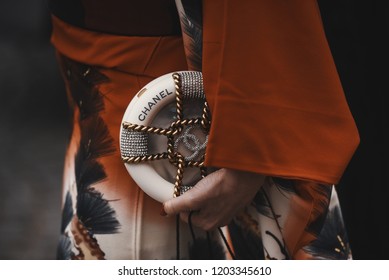 October 2, 2018: Paris, France - Fashionable girl wearing a Chanel bag outside a fashion show during Paris Fashion Week  - PFWSS19