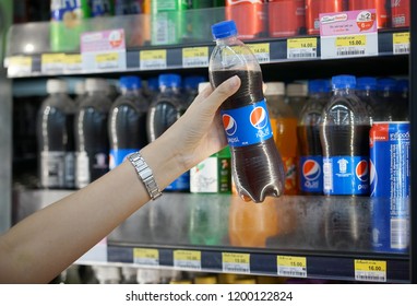 October ,2018 : Woman Holding Pepsi​ At Seven Eleven Shop,​Bangkok,Thailand