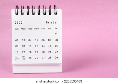 October 2022 Desk Calendar On Pink Color Background.