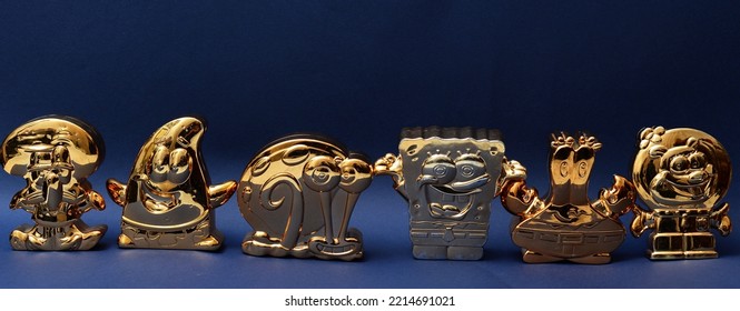 October 2022, Istanbul, Turkiye: Gold Figurines Of Spongebob Squarepants By Burger King Meal Toys.