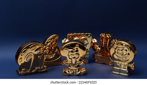 October 2022, Istanbul, Turkiye: Gold Figurines Of Spongebob Squarepants By Burger King Meal Toys.