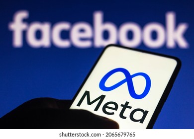 October 29, 2021, Brazil. In this photo illustration the Meta logo seen displayed on a smartphone and in the background the Facebook logo