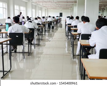 October 30, 2019, Kolkata, India. Medical students writing a medical examination in examination hall wearing white coats during day time at NRS Medical College Kolkata, India.