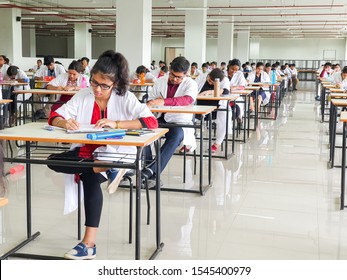 October 30, 2019, Kolkata, India. Medical students writing a medical examination in examination hall wearing white coats during day time at NRS Medical College Kolkata, India.