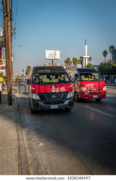 October 6, 2020: Red community taxis on street in\
Tijuana Mexico. 